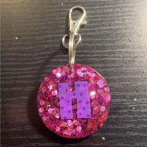 Purple circle “H” keychain $10
